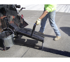Crafco Mastic One product container — the polymer modified asphalt mastic we use
