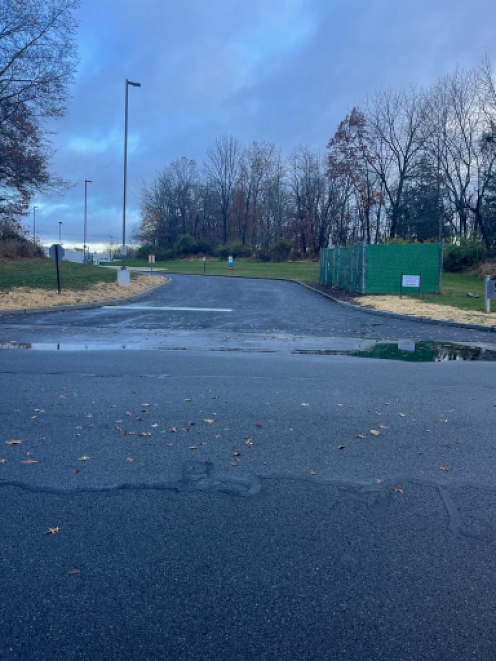 Freshly paved section of a commercial parking lot and access drive in NJ